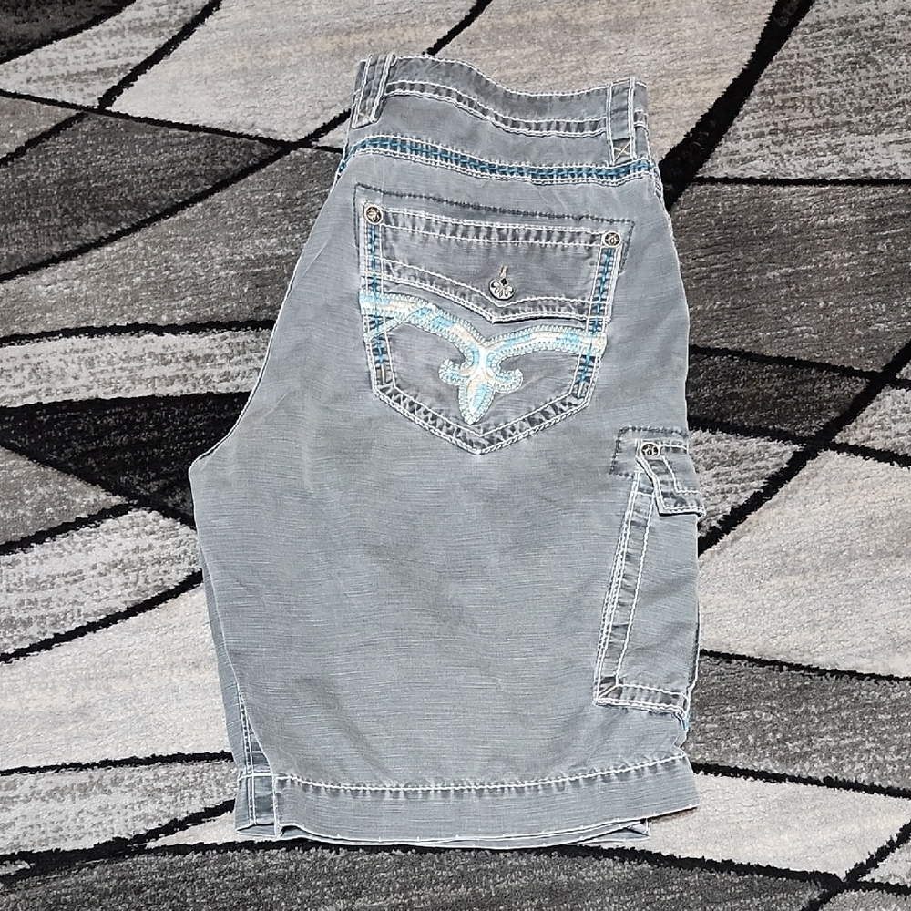 ROCK REVIVAL SLIM GUNMETAL BLUE COLOR-POP FLEUR-DE-LIS FAUX-FLAP CARGO SHORTS